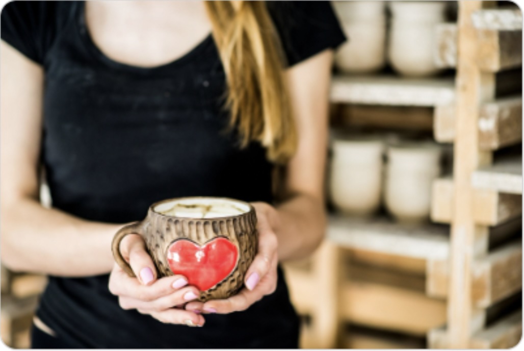 Artisan holding ceramic